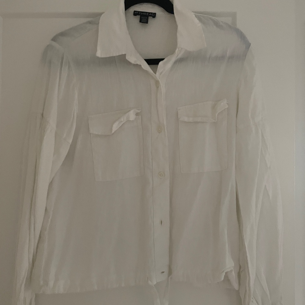 White billowed sleeve button down blouse